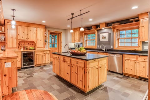 The spacious kitchen is filled with everything needed to prepare a meal at home