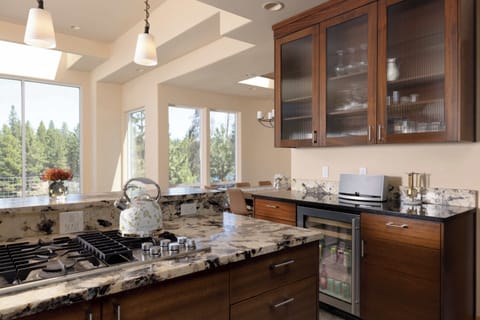 The elegant kitchen offers ample space & all the comforts of home