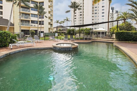 Start your day with a refreshing dip in the tropical-style shared pool, surrounded by swaying palms and sun loungers perfect for slow, sunny mornings.
