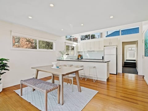 The dining area invites family meals, game nights, or long conversations with loved ones over shared dishes and good company.