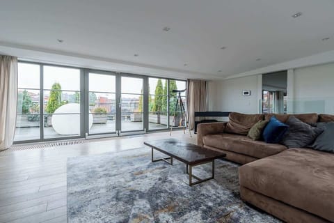 Spacious living room with direct access to the terrace.  The big lamp outside becomes your personal moon at night - try it, it's magnificent!