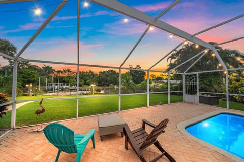 Backyard and screen-in lanai overlooks the canal, perfect for evening sunsets or morning coffee watching Florida wildlife and manatee viewing. Fresh mangos and banana tree in backyard!