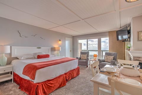 Experience the serene ambiance of this King Bed Studio, featuring a comfortable king bed and picturesque ocean views, perfect for a cozy resort-style getaway.