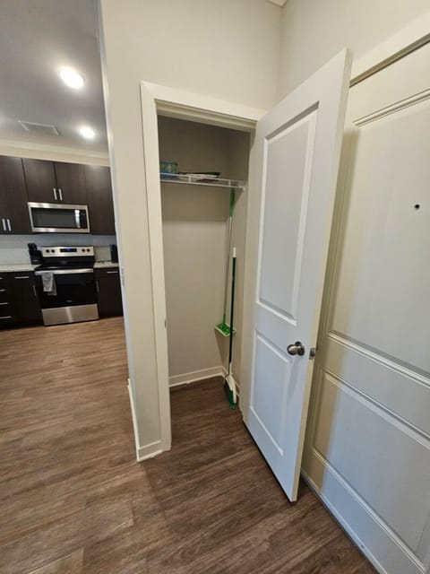 Practical utility closet offering easy storage for cleaning items and personal use during your stay.