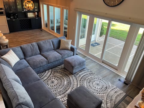 Main level living room - Relaxing space with comfy furniture & lakeside view