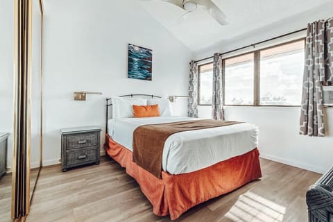 Drift off comfortably in a bright bedroom with crisp linens.