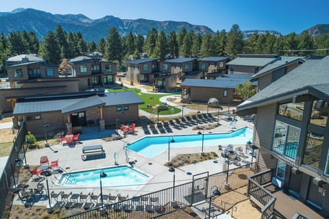 Dive into sunny pool days with expansive mountain backdrops.