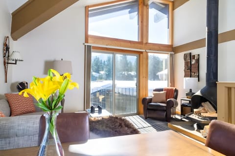 Soak up mountain light beside the cozy fireplace lounge.