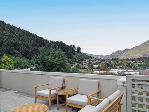 Take in sweeping mountain views from your private balcony seating area.