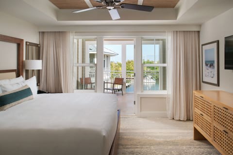 Sink into crisp linens and wake to balcony views.