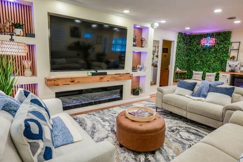 85in TV, reclinging couches, adjustable LED lighting, and surround sound.