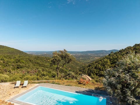 stunning views of the wooded hills and the sea in the distance