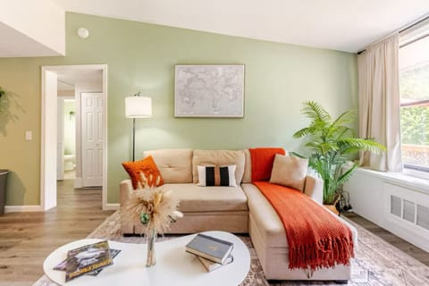 Modern living area with plush seating and vibrant accents