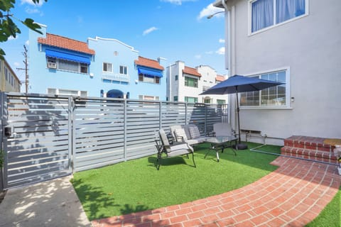 lush greenery and stylish outdoor furniture create a relaxing resort like vibe