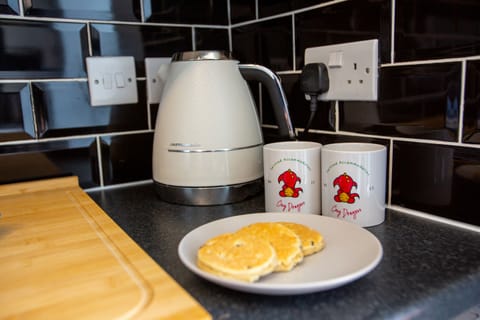 Cosy Dragons cup of tea with welshcakes