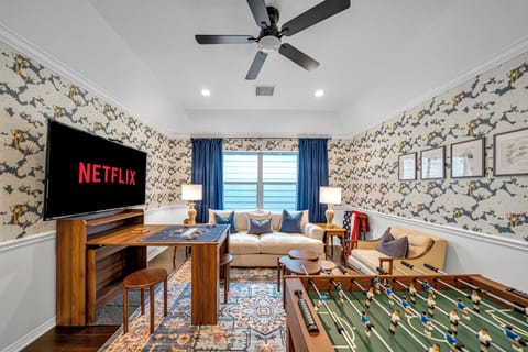 Bonus living space with foosball table, puzzle station, and large Roku TV!