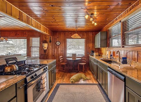 The kitchen is fully stocked with cookware, utensils, and spices.