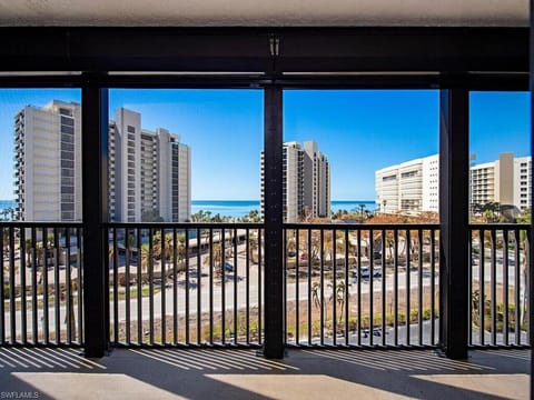 Private balcony with sweeping Gulf and bay views across from Vanderbilt Beach