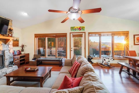 Cozy living room with fireplace & mountain light