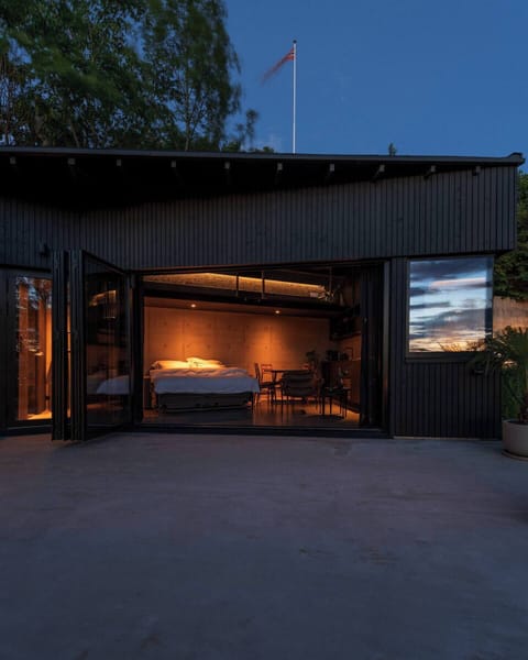 Architect-designed cabin with modern Nordic lines and soft, ambient lighting