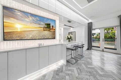 1st FLOOR: LIVING ROOM / PARTY LOUNGE features translucent stone with backlighting that surrounds our large smart TV where you can karaoke, watch a game, or Netflix and chill. 