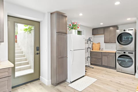 Fully stocked kitchen with everything from cookware to a coffee maker.