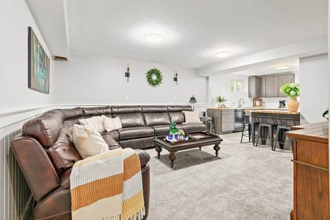 The Living room is spacious enough to stretch out and enjoy your time with family or friends while also being close to the kitchen to make a yummy meal!
