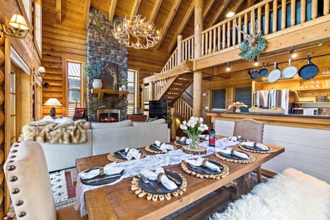 Elegant cabin dining with rustic charm and the warmth of a glowing fire
