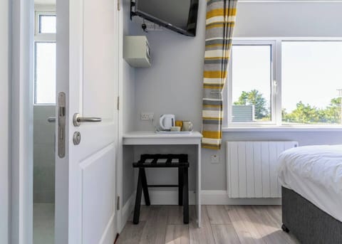 Tea/coffee station and suitcase holder.