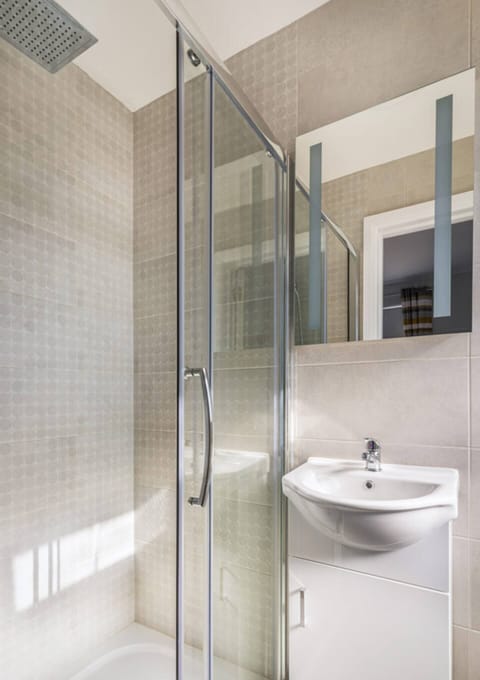 Shower and sink. Hairdryer included below sink.