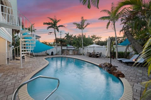 Relax by the pool at Calm Under the Palms, Siesta Key 3BR.
