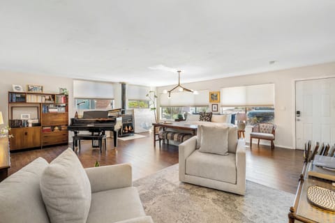 Bright and open living area with modern furnishings, perfect for relaxing or entertaining with family and friends.
