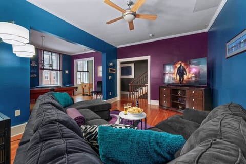 Lounge & Play – A cozy seating area with plush couches, adding comfort to the game room experience.