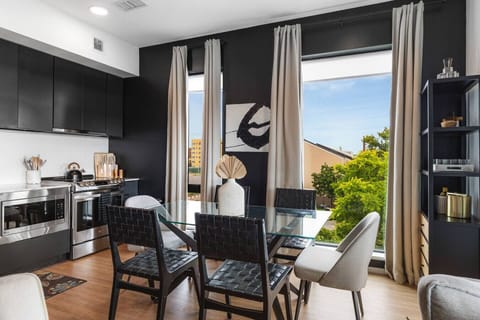 Our kitchen is fully equipped with high-end appliances and two dining areas. Private balcony off of this area to enjoy your morning coffee.