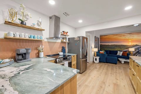Kitchen: Spacious and well-equipped with room to spread out, cook family meals in the fully-equipped gourmet kitchen, and gather nearby.  This central hub connects seamlessly to the home’s living spaces for an easy, relaxed vacation experience.