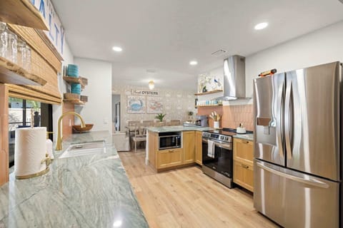 Kitchen: Bright and functional with full-size appliances, generous counter space, and an easy flow into the dining area—giving your group a practical setup for morning coffee, quick lunches, and shared meals.