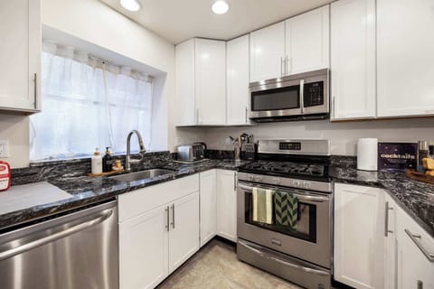 Fully stocked kitchen with stainless steel appliances, ready for your cooking needs.