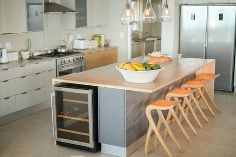 Kitchen with wine, cooler, full lenth fridge freezer