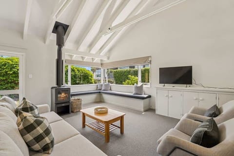 Sunny open plan living with fireplace