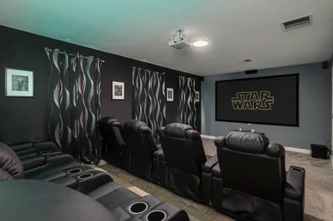 Private in-home movie theatre with HUGE projector screen and surround sound! Reclining theater seating for 8 + extra room to accommodate 10+! Great for family movie nights or for big game day viewing!