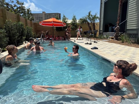 Saltwater pool features two Baha ledges with in-pool sun loungers.