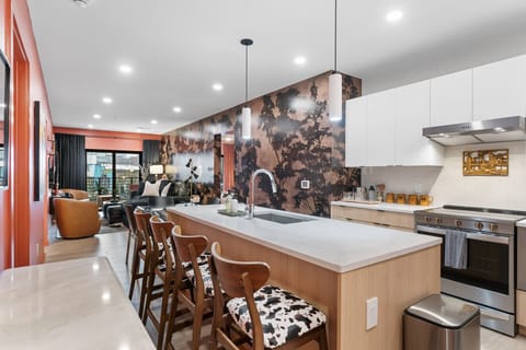 Cook, chat, and create memories in this open kitchen that’s designed to be both functional and beautifully social