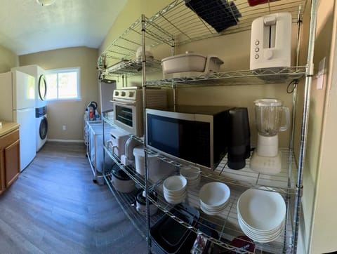 LRG capacity stacked washer/dryer, fridge/frz, iron/board/steamer, & 1st aid kit