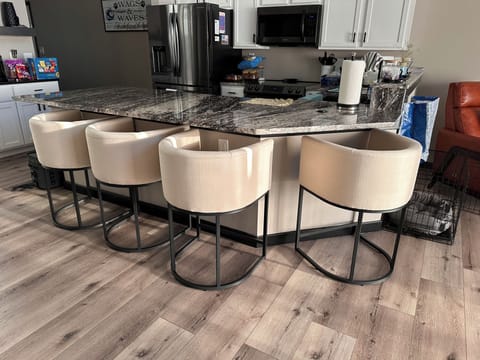 Large Kitchen island with seating for 4 in comfortable bar stools.