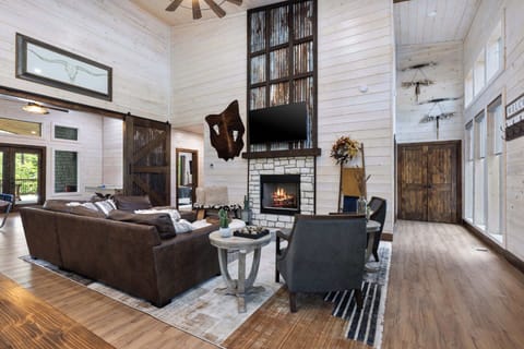 Kick back and relax in our stylish haven! With a cozy fireplace, comfy seating, and a touch of rustic charm, our living space is perfect for unwinding after a day of adventure (or just a day of lounging). Who's ready to put their feet up?