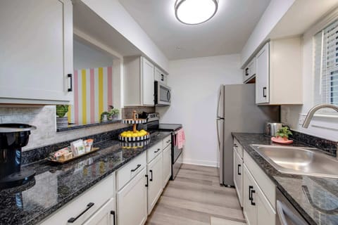 Sleek countertops and chic decor make this kitchen a culinary delight!