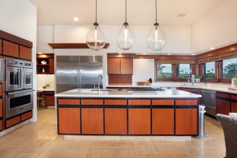 Your gourmet kitchen features premium stainless steel appliances and spacious island for memorable cooking experiences.