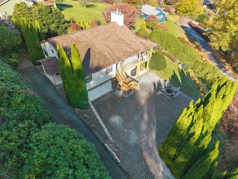 Peaceful mountain retreat surrounded by lush gardens and greenery

