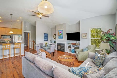 The heart of this vacation retreat is its spacious living room, where comfort meets coastal style.