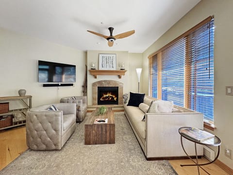 Cozy living area with seating for 5, gas fireplace, and 55` smart TV. Perfect for gathering after long days on the slopes to share stories and plan tomorrow`s adventures.